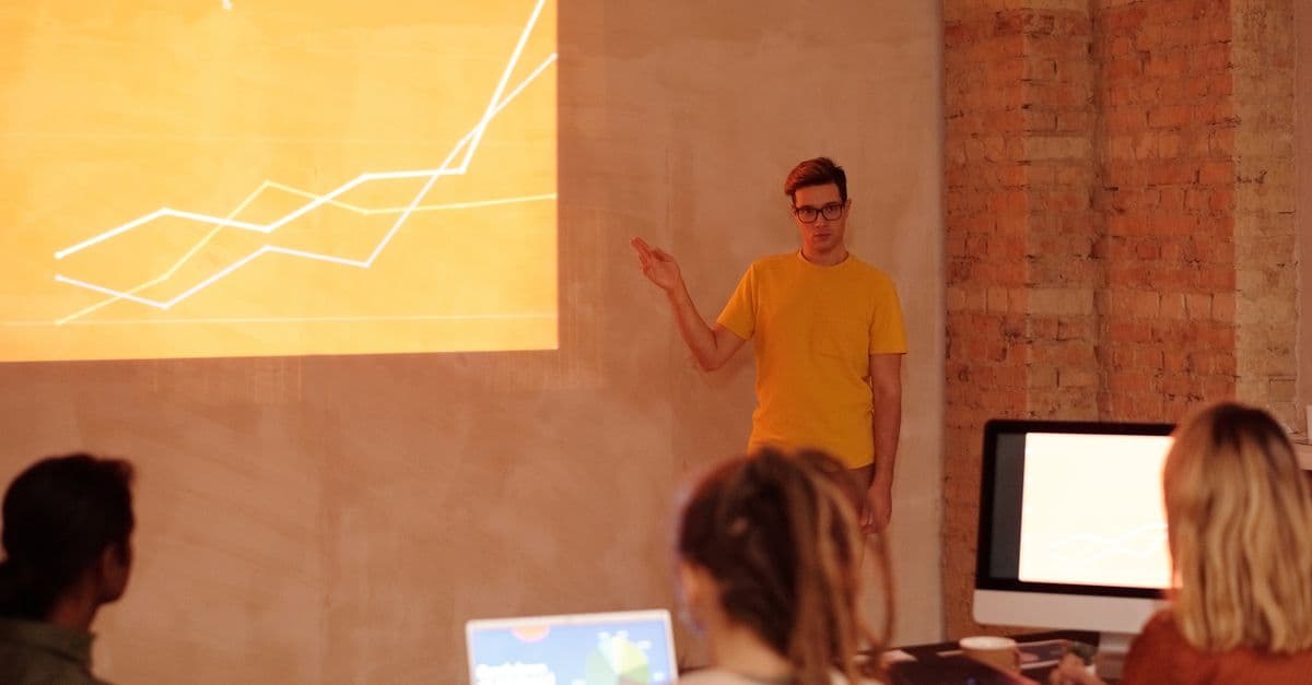 A facilitator presenting to a team in a workshop