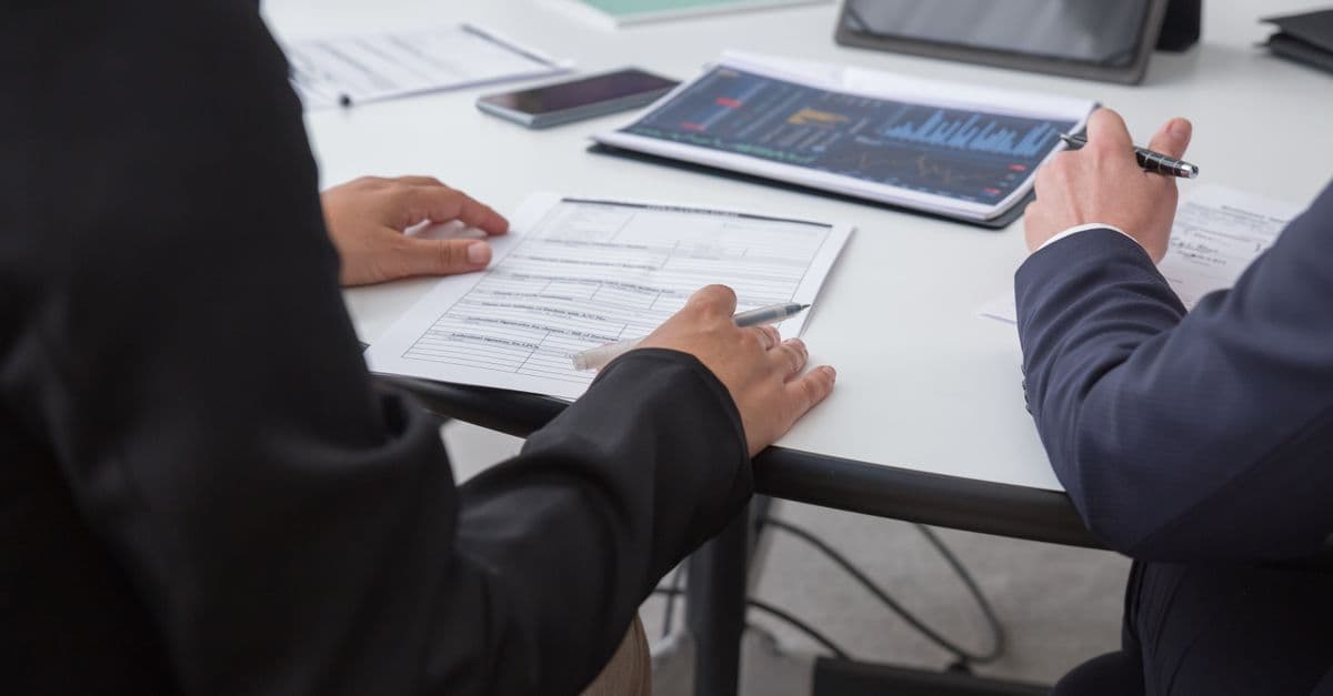 A team reviewing analytics documents together
