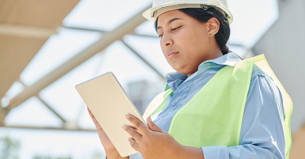 A field engineer with a tablet on site