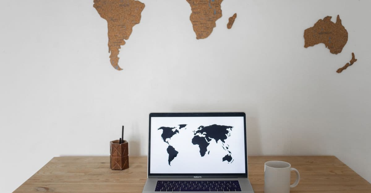 A world map spread across a workspace