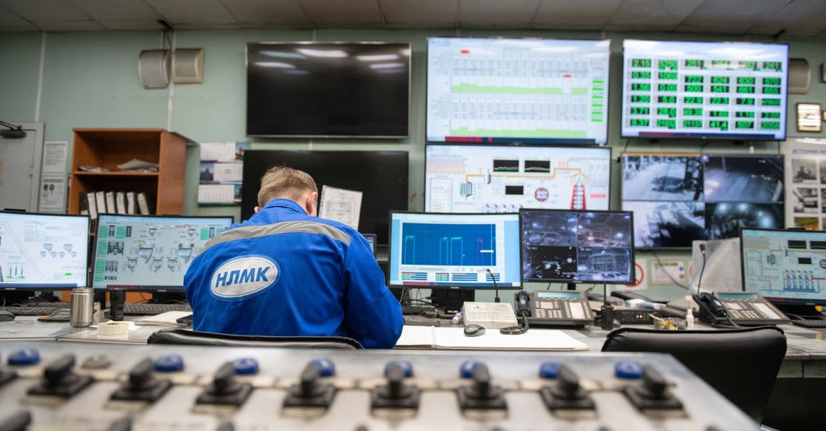 An engineer monitoring screens in a control room