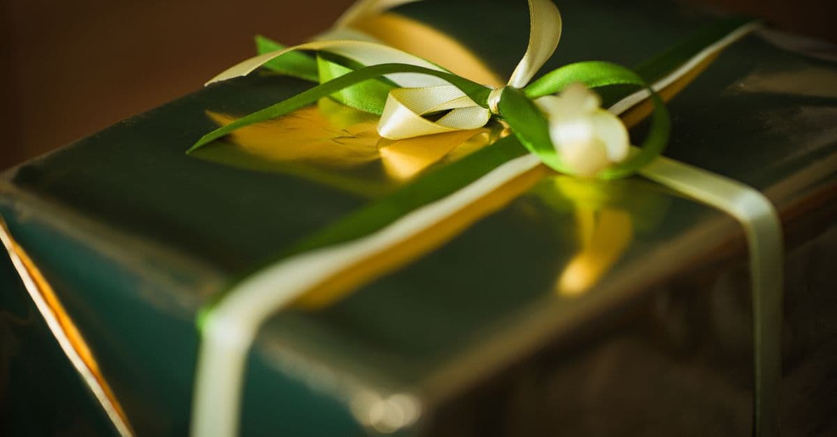An elegantly wrapped gift box in warm light