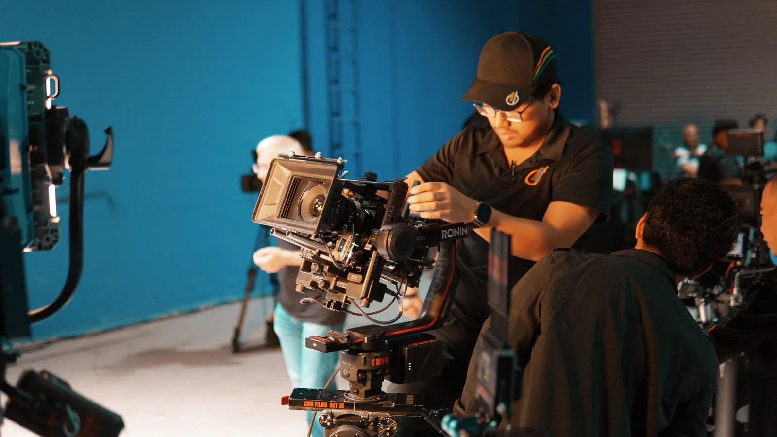 A film crew operating a professional camera